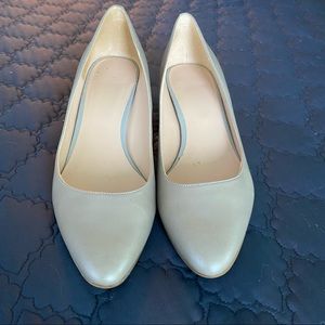 Cole Haan shoes. Closed toe. 2” cork heel. Silver leather. Size 10.
